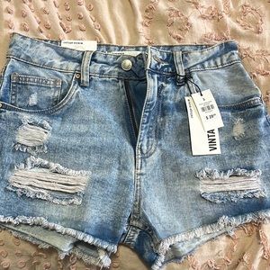 urban outfitters light blue ripped denim shorts!
